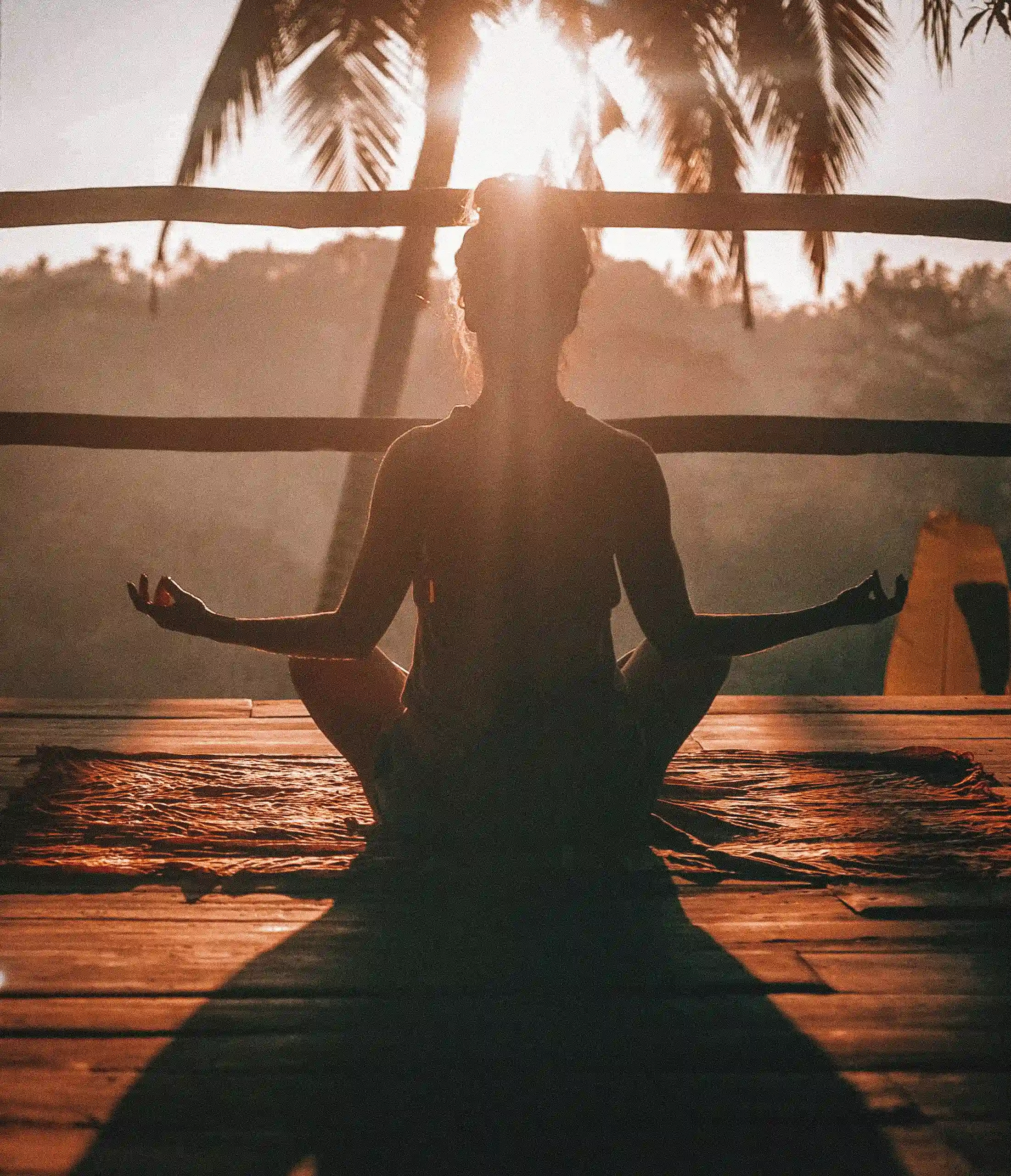 Person meditating peacefully in serene nature