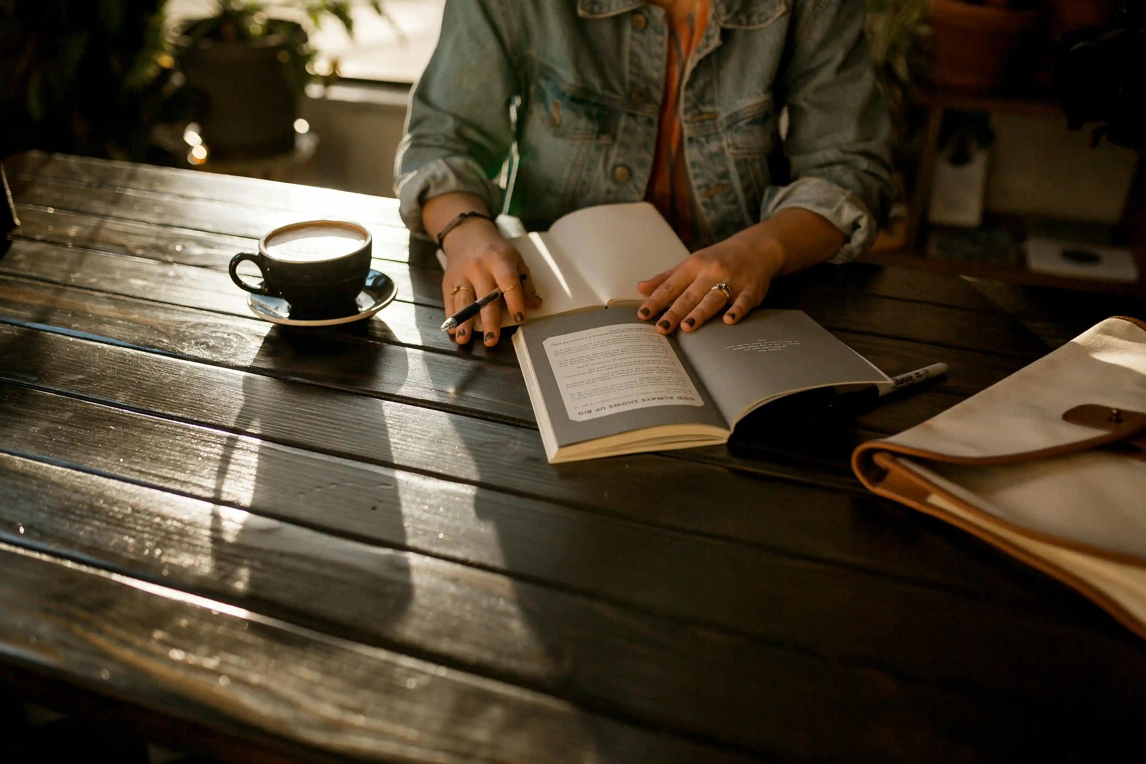 Open journal with pen, symbolizing the act of journaling for mental clarity